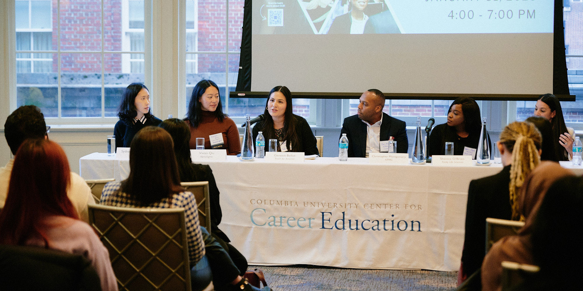 Five women and one man sit on a panel in front of a packed audience of students at the 2023 Diversity Recruiting Showcase on January 31, 2023