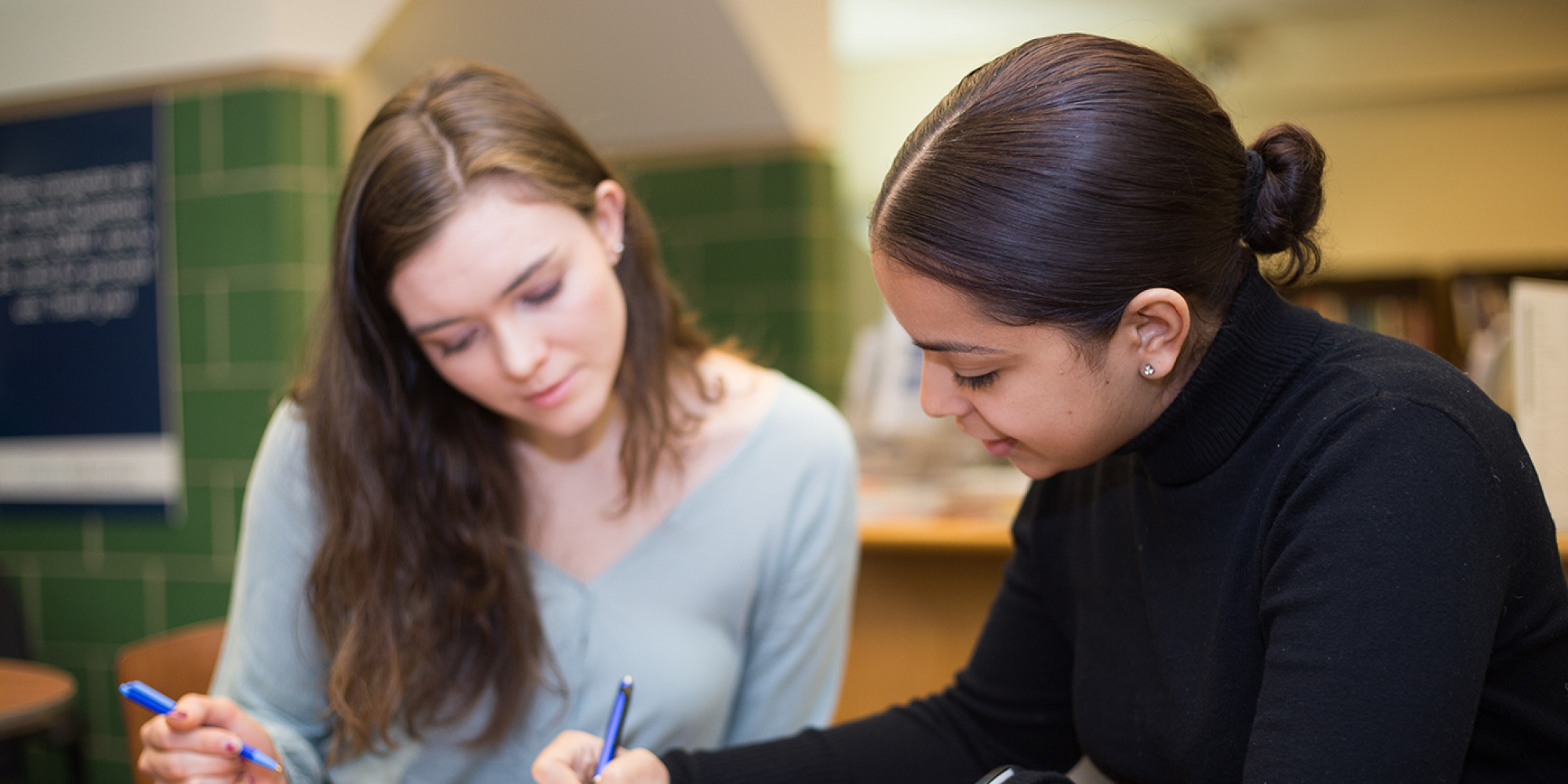 Student working on resume with counselor in CRC