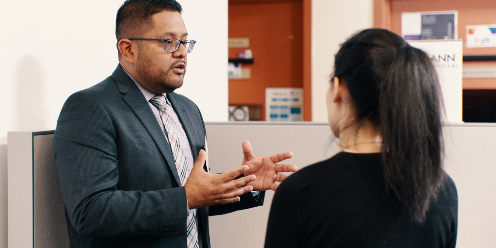 Employer speaking with a student in the CCE lounge