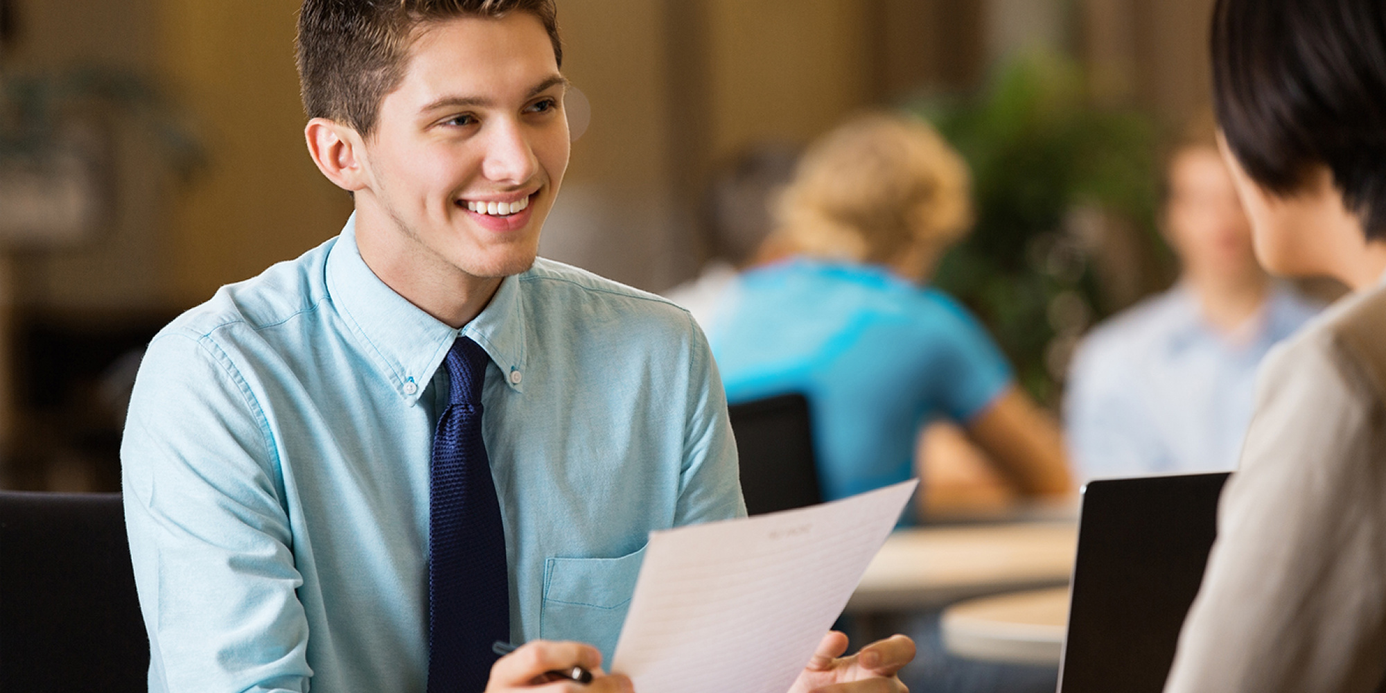 Young professional college student with resume at job interview - Stock image.jpg 