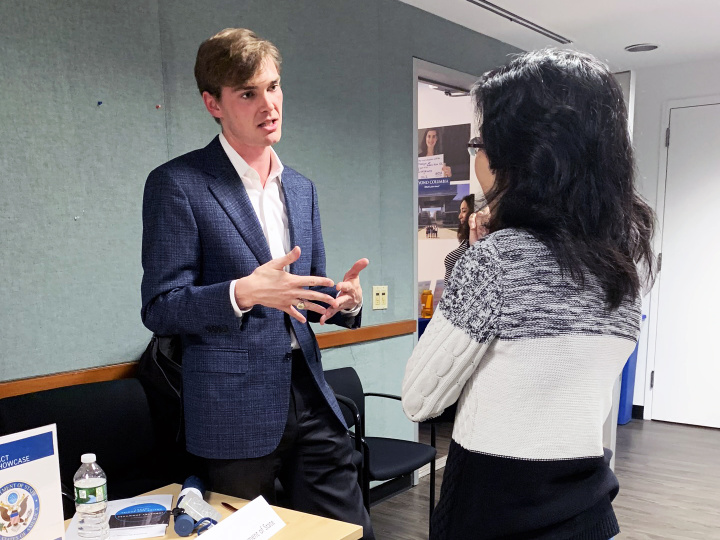 Student and employer representative at the Policy and Social Impact Showcase.