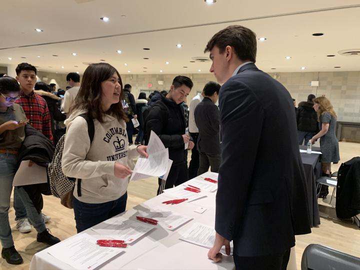 Student speaking with employer representative.