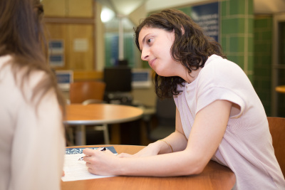 Counselor and student going over resume in CRC