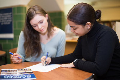 Student working on resume with counselor in CRC