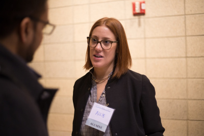 Alumni recruiter speaking to students at startup career fair