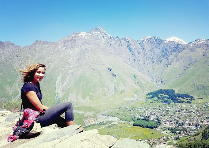 Student on the mountains looking at camera