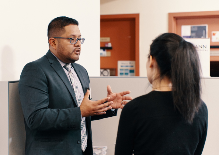 Employer speaking with a student in the CCE lounge