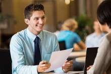 Young professional college student with resume at job interview - Stock image.jpg 